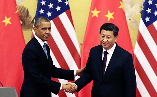 ong tap (phai) bat tay voi ong obama. anh: scmp